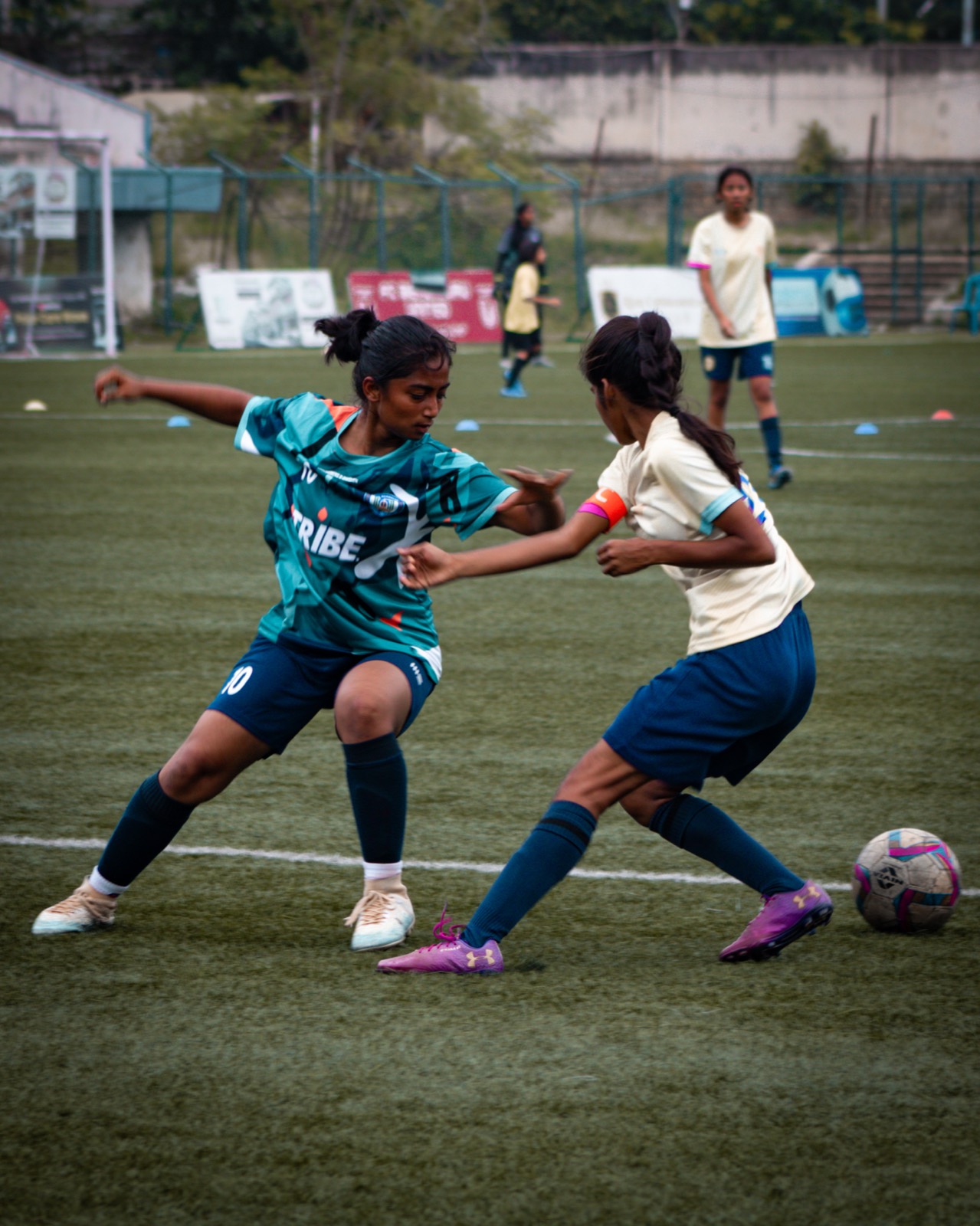 Two girls competing for the ball during an FC Real Bengaluru match in Bengaluru